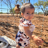 WESTERN SUNSET COW PRINT ROMPER